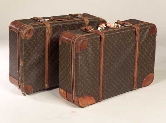 A pair of Louis Vuitton suitcases,