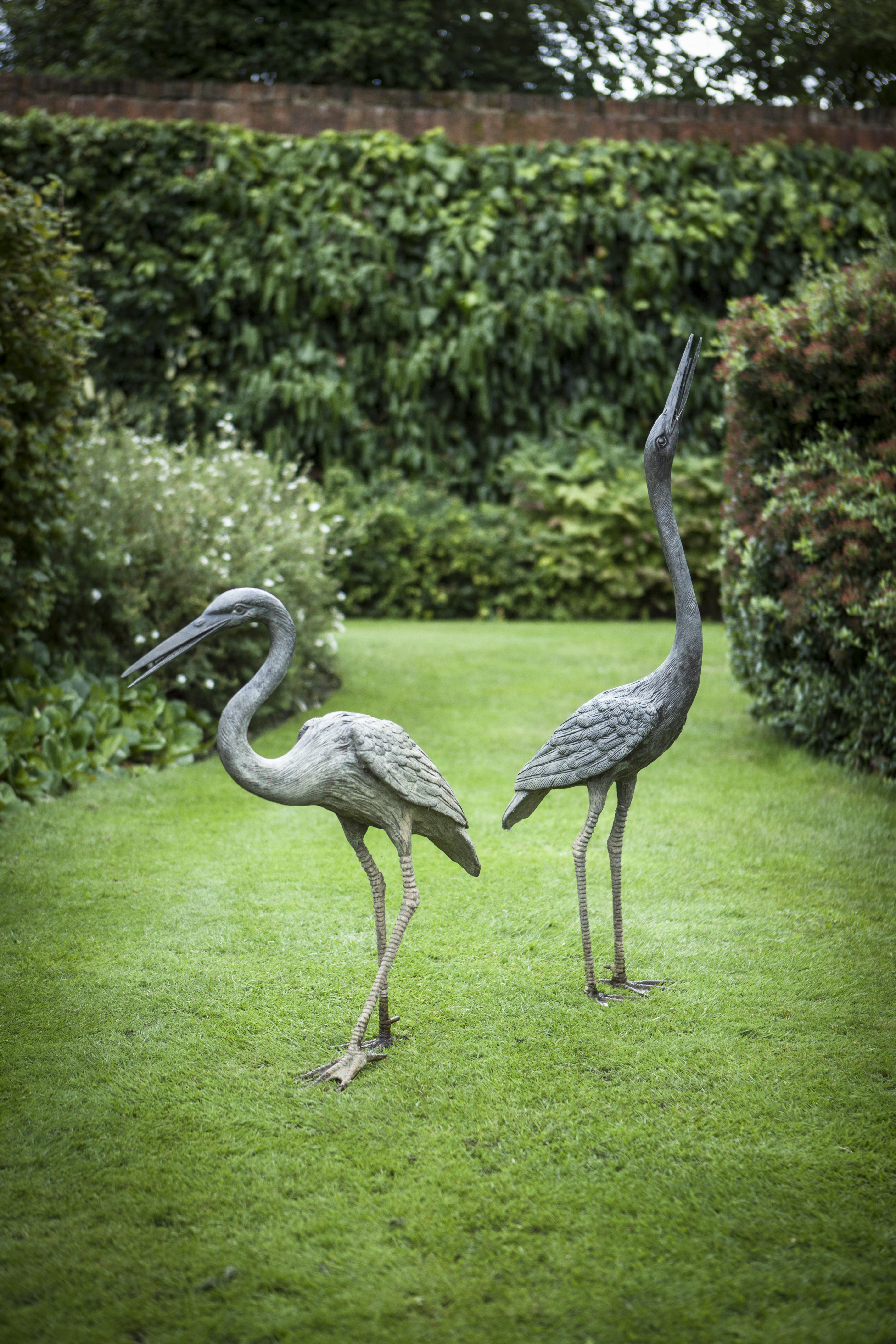 PAIR OF BRONZE FIGURES OF HERONS