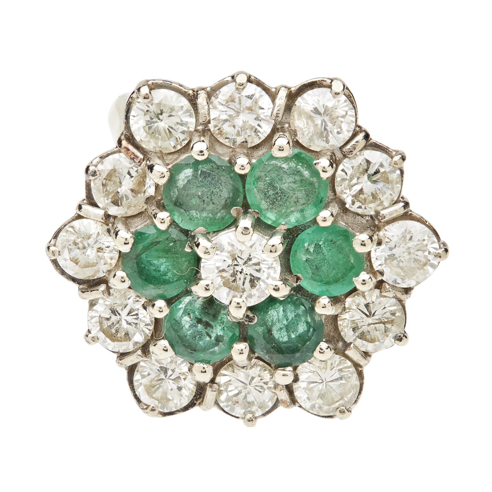 An emerald and diamond set cluster ring