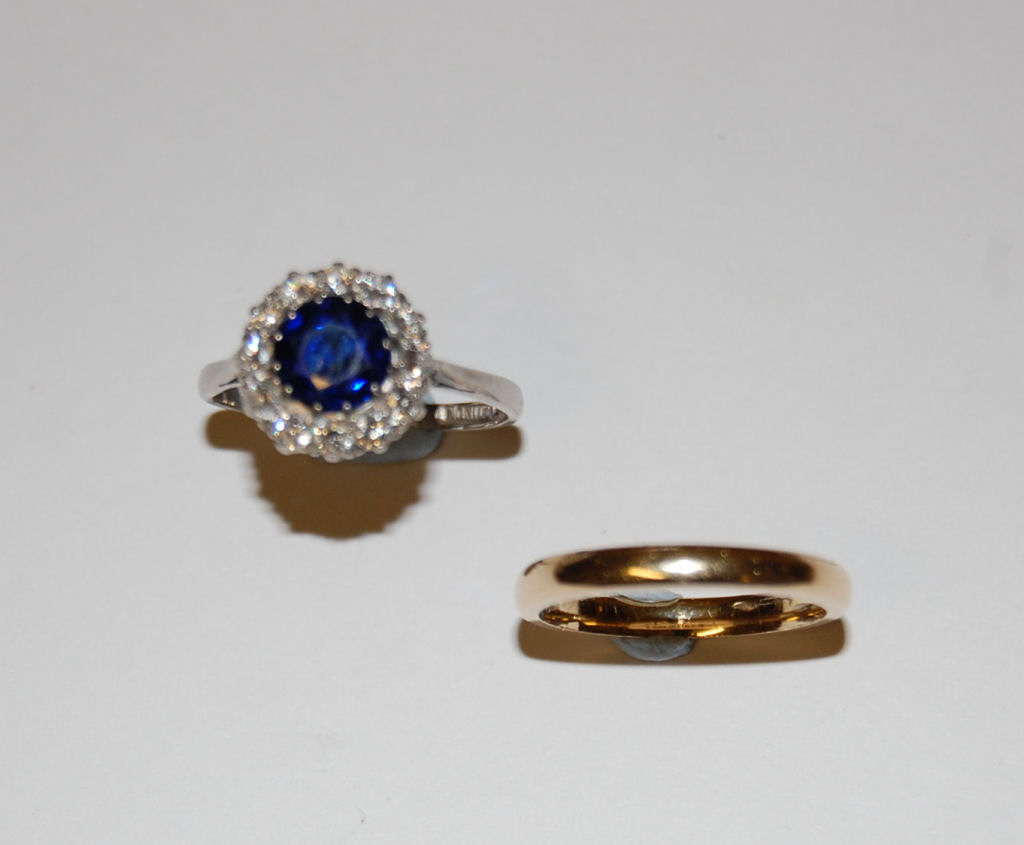 A sapphire and diamond cluster platinum mounted ring
