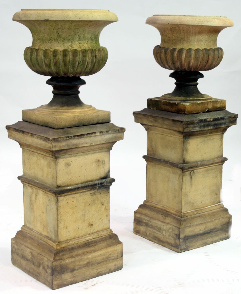 A pair of 19th century Garnkirk terracotta garden urns and stands