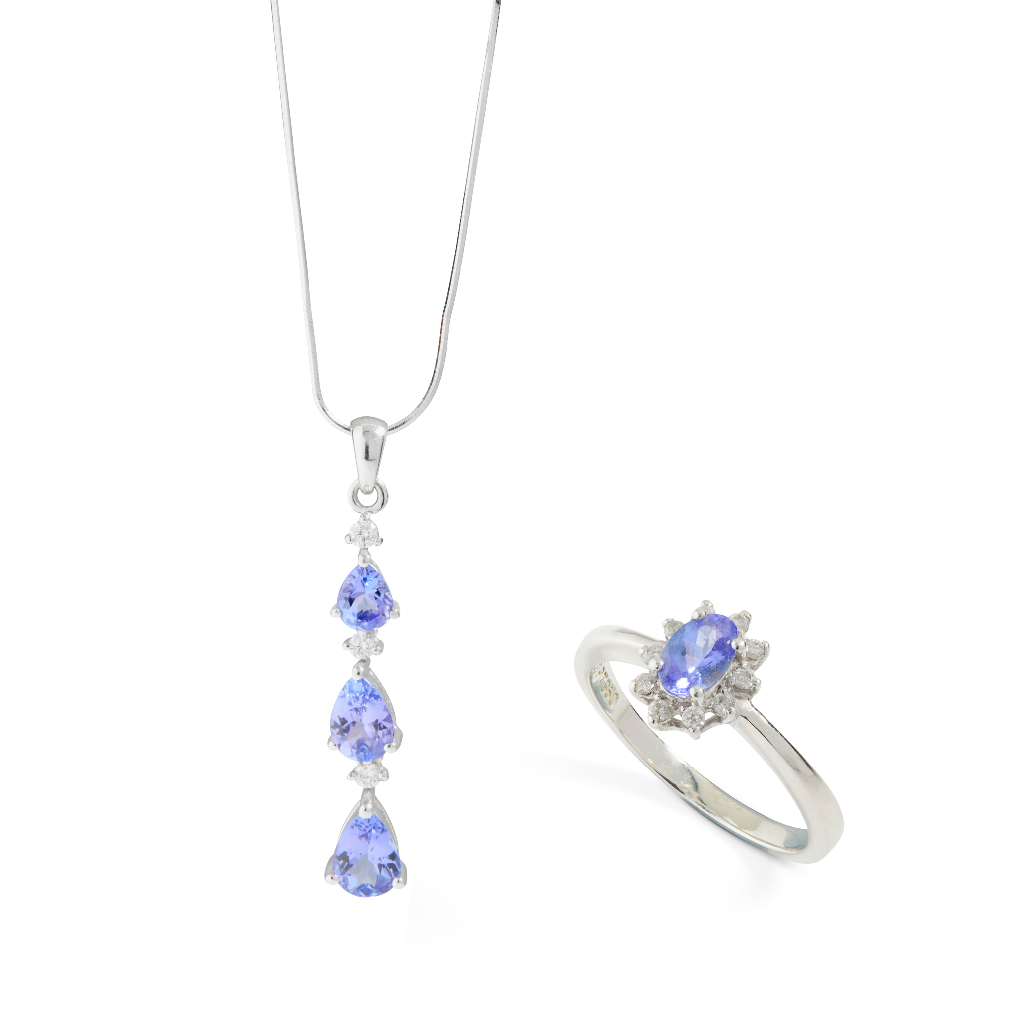 A 18ct gold Tanzanite and diamond drop pendant and ring