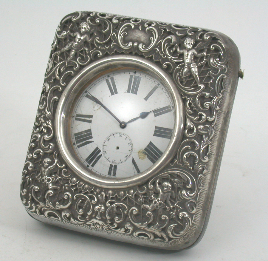 A late Victorian mounted travelling clock,