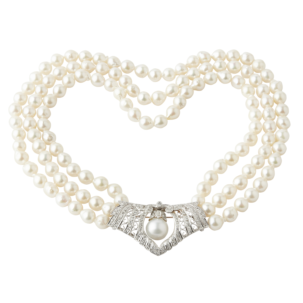 A three row cultured pearl and diamond set necklace