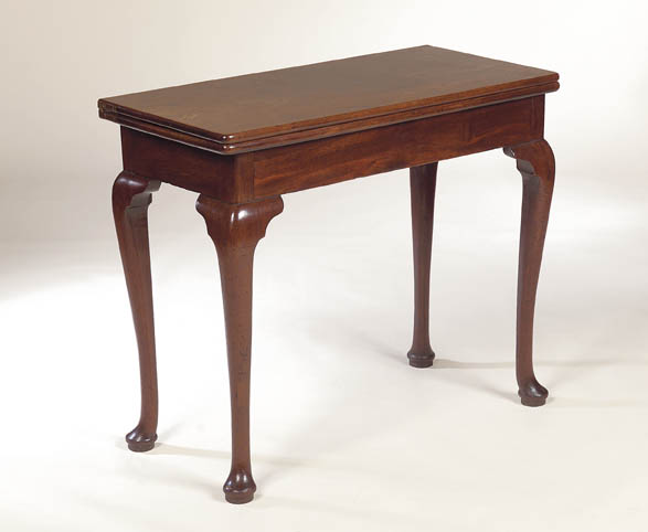 A George II mahogany foldover tea table,