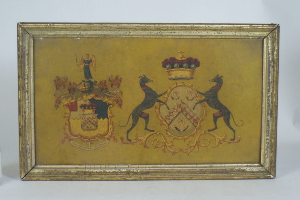 A 19th century mahogany coach panel with double heraldic arms Possibly for the Forrester family of Corstorphine