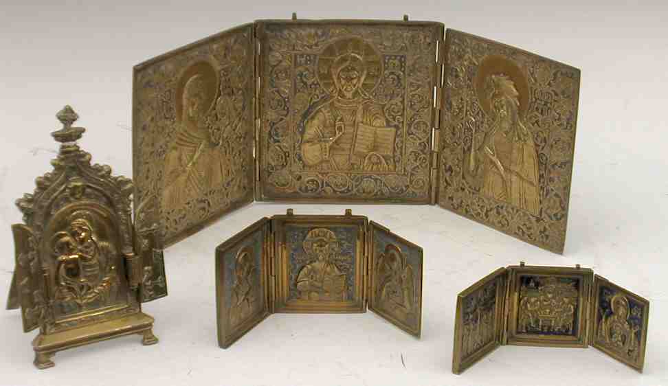 A collection of four brass devotional triptychs,