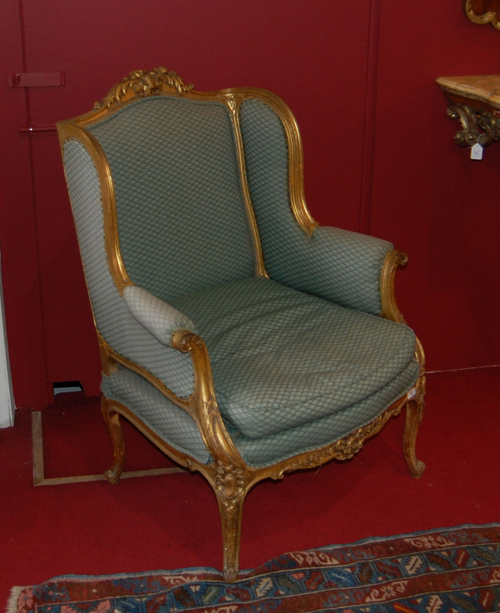 LOUIS XV STYLE CARVED GILT WOOD AND UPHOLSTERED ARMCHAIR
