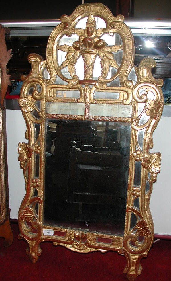 A Rococo style gilt mirror