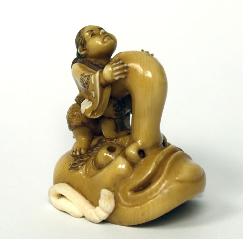 JAPANESE CARVED AND STAINED NETSUKE