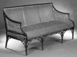 A George III faux bamboo caned settee