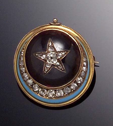 A Victorian garnet and diamond set brooch,