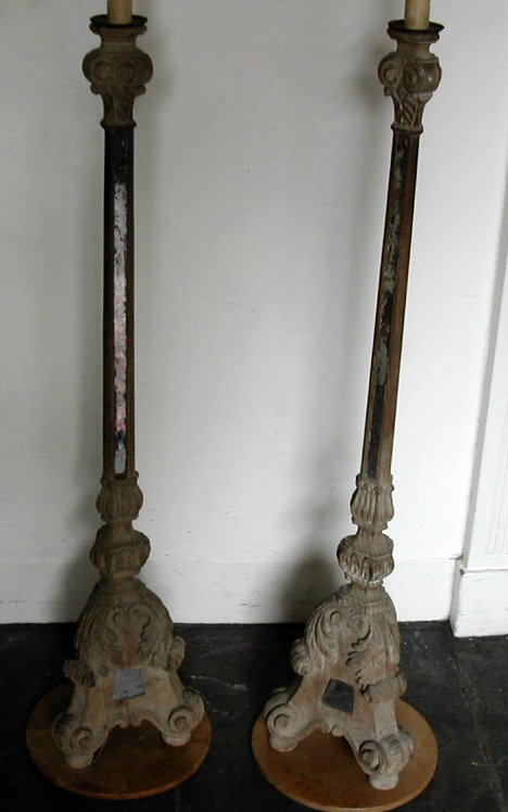 A pair of Italian carved pine altar candlesticks,