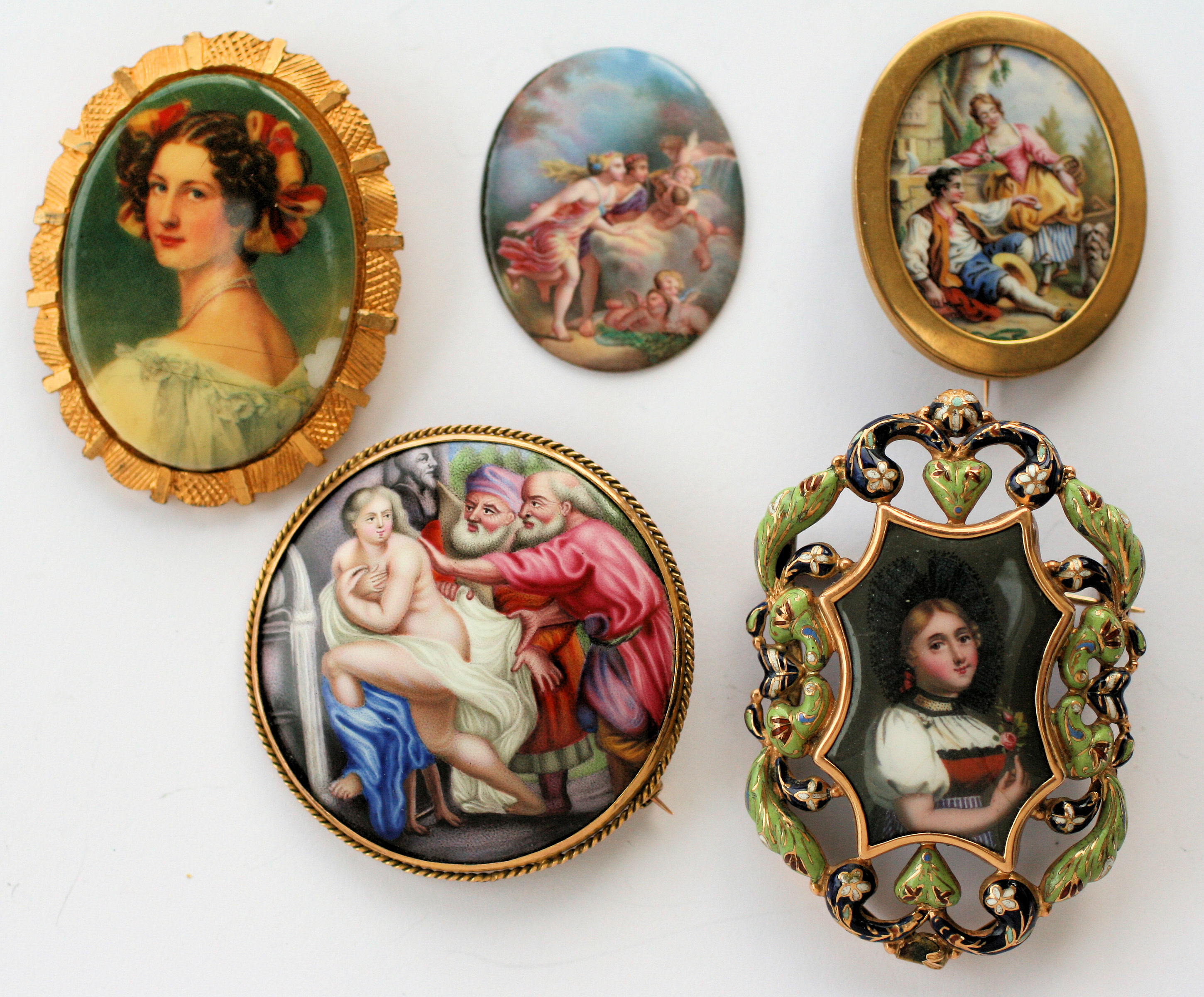 A group of four enamel brooches