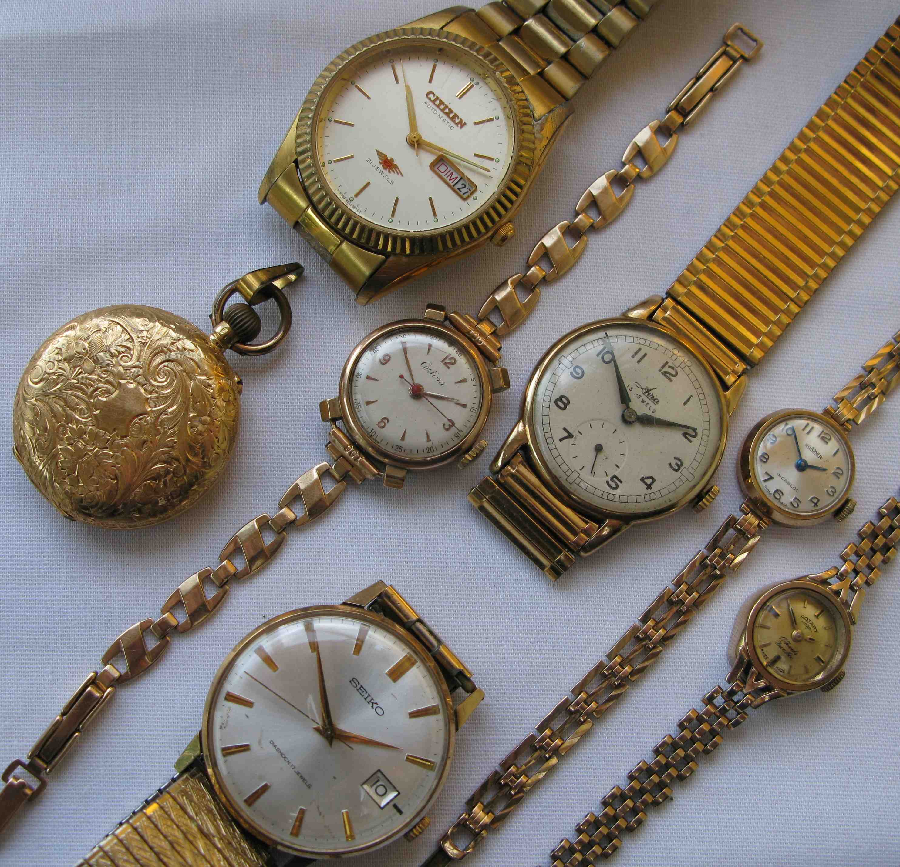 A group of various gold watches to include