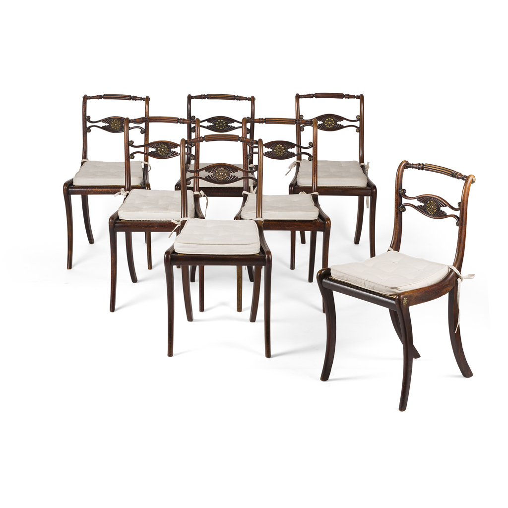 SET OF SEVEN REGENCY ROSEWOOD GRAIN PAINTED AND BRASS MOUNTED DINING CHAIRS