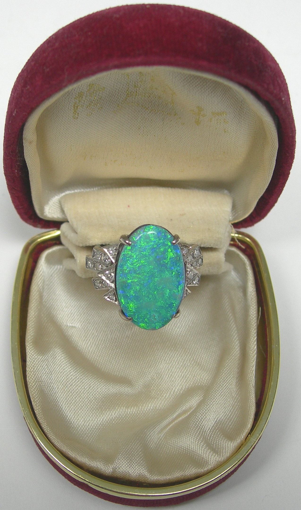 A black opal doublet and diamond set ring,