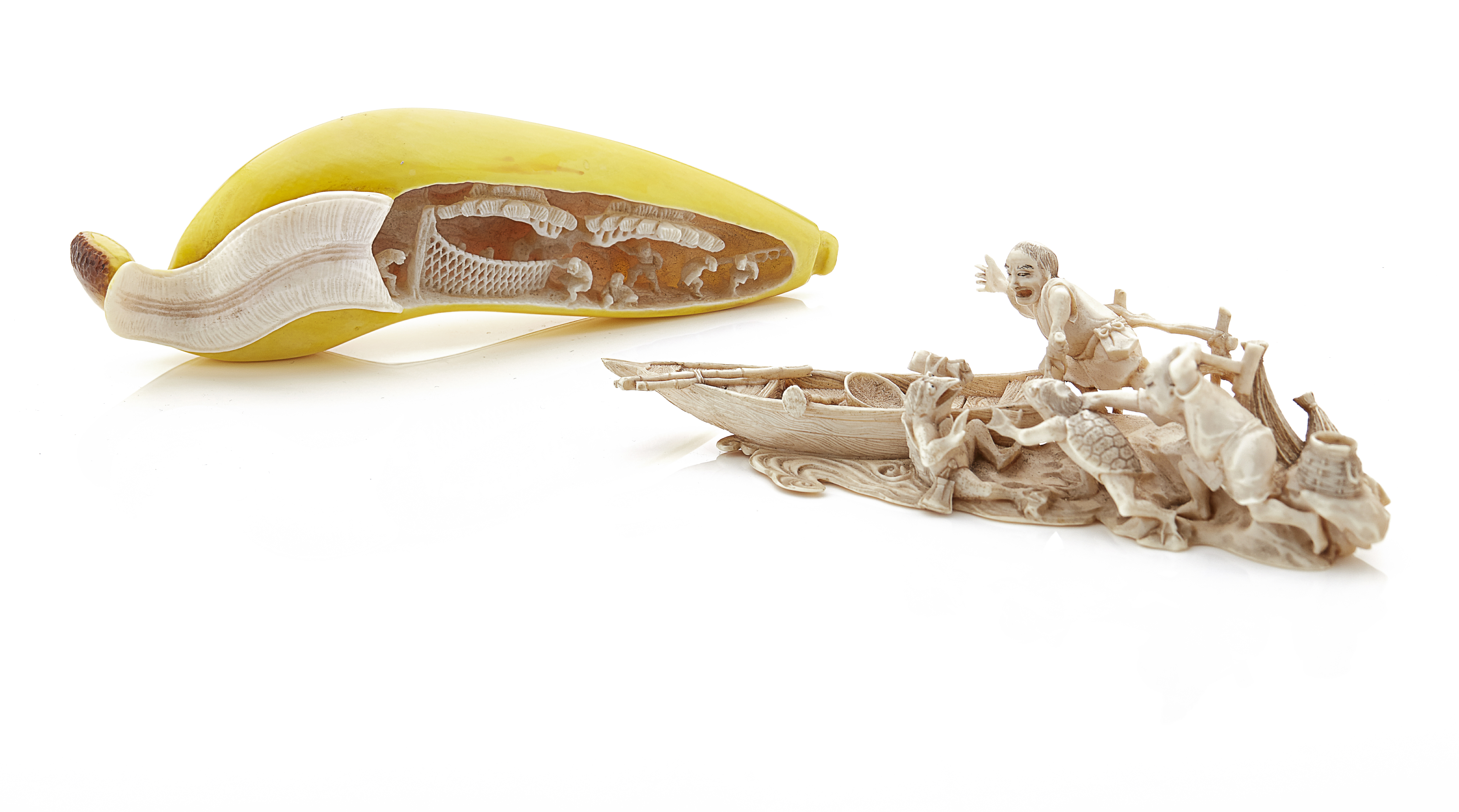 TWO CARVED IVORY OKIMONO