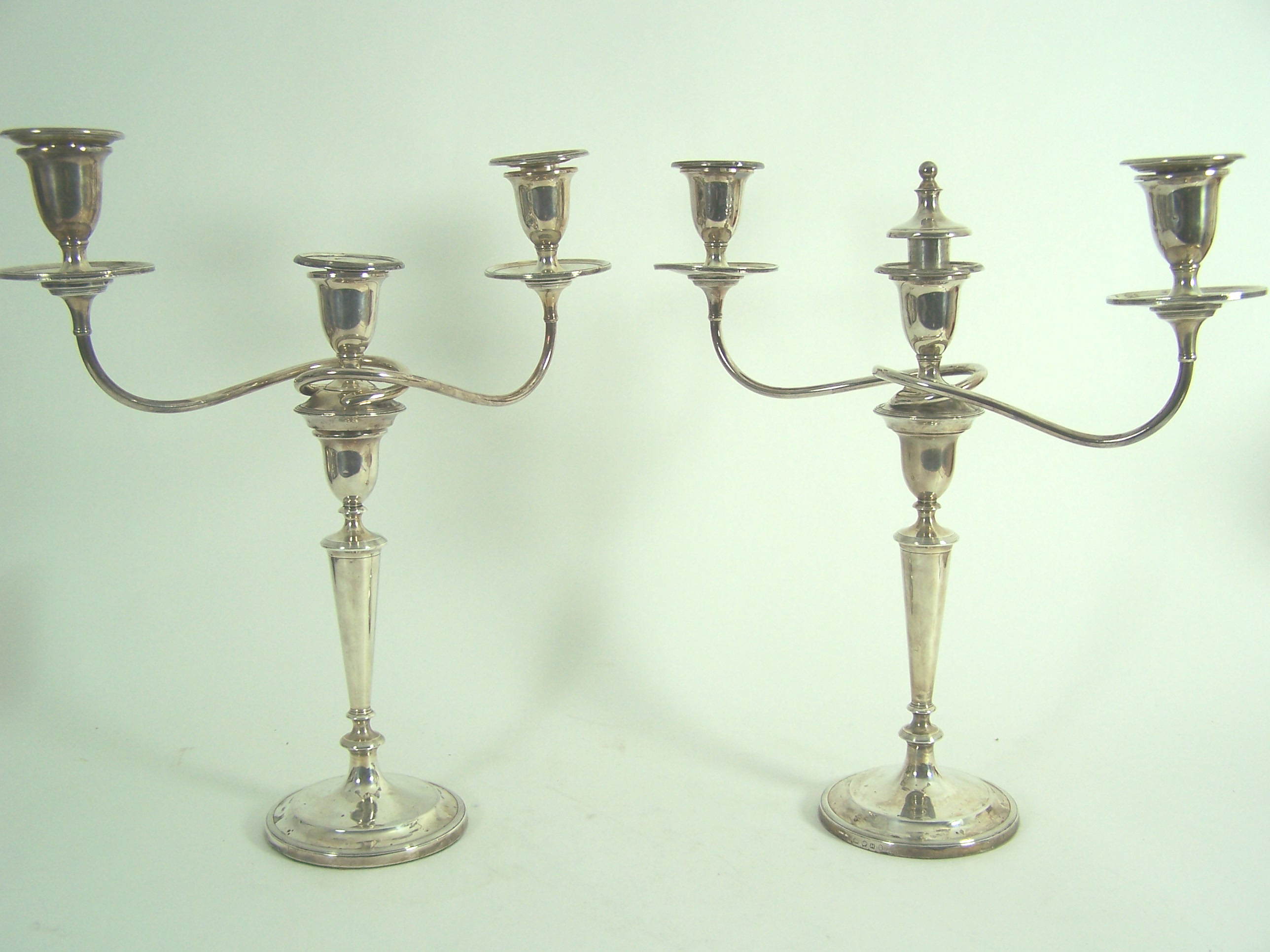 A pair of George III table candlesticks,