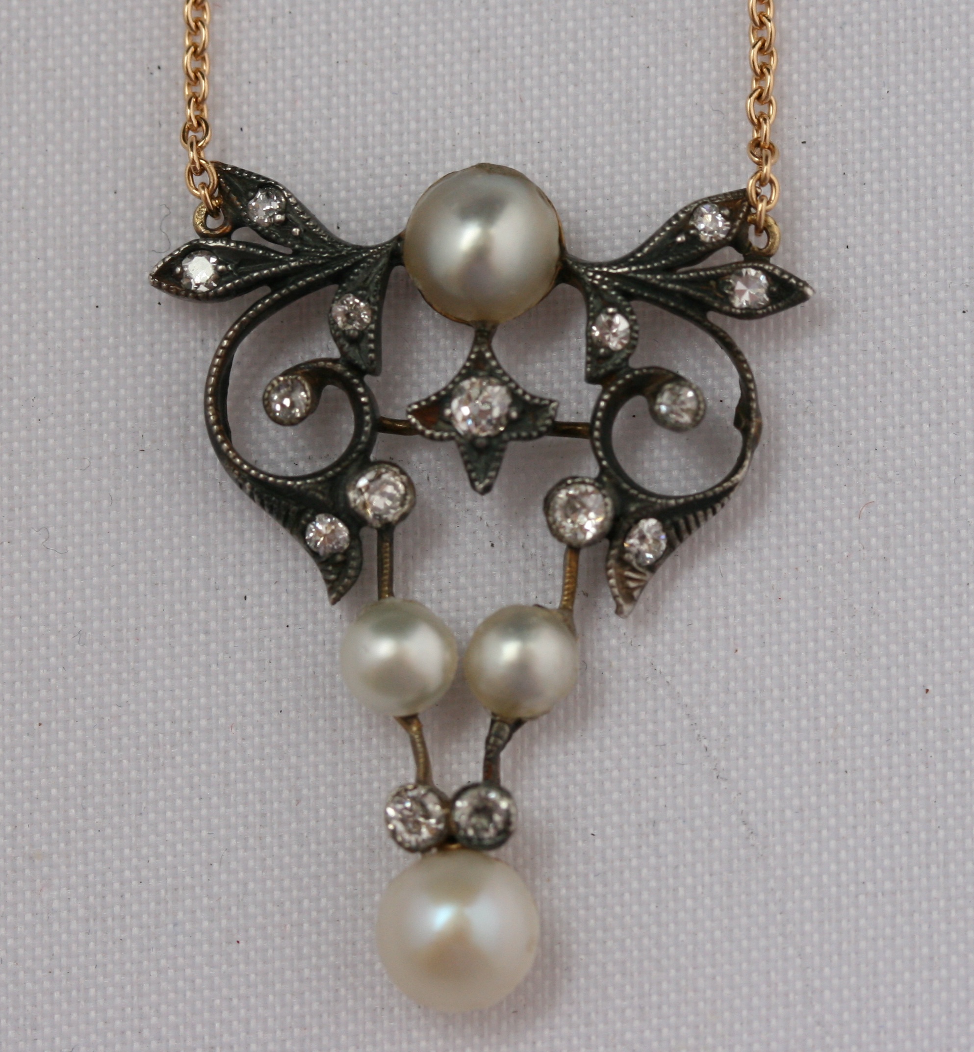 An Edwardian pearl and diamond set pendant