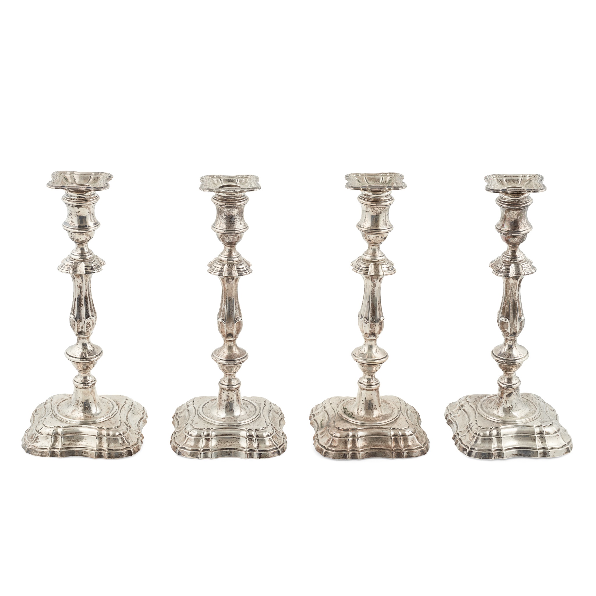 A set of four late Victorian candlesticks