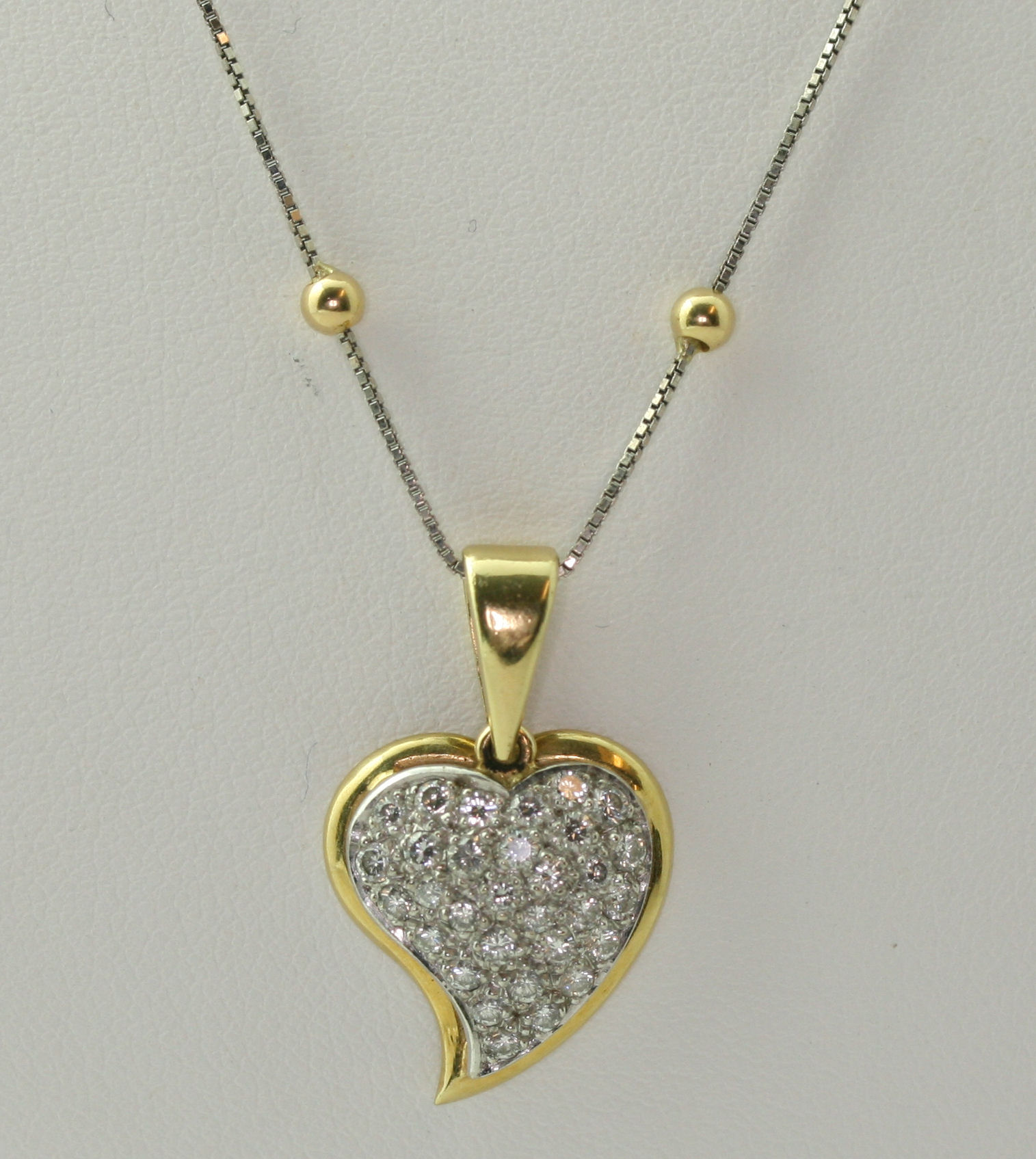 An 18ct gold diamond set pendant