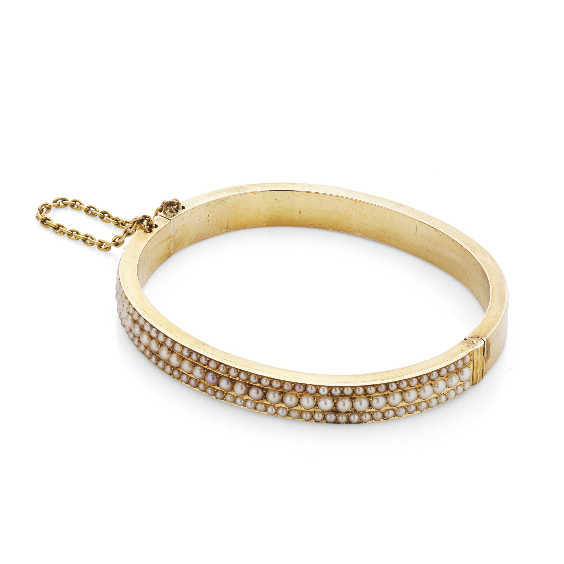 A pearl set hinged bangle