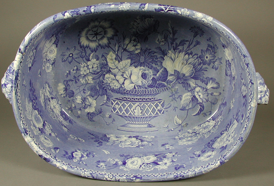 A semi-china all over printed rounded rectangular twin handled footbath