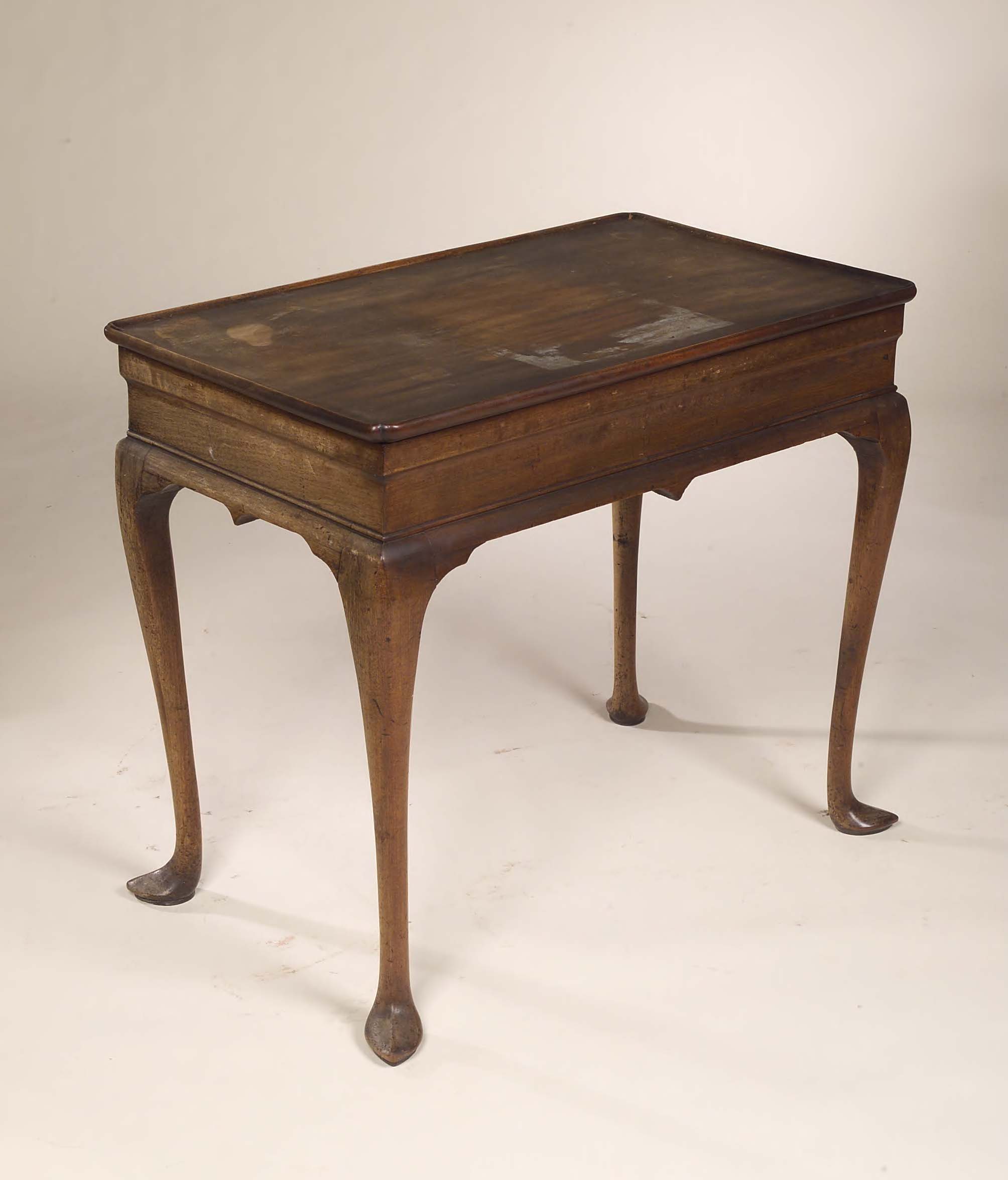 An early 19th century mahogany silver table in George II style,