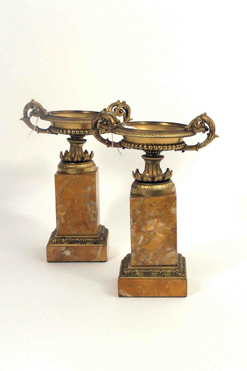 A pair of French Empire style gilt bronze and siena marble tazzae