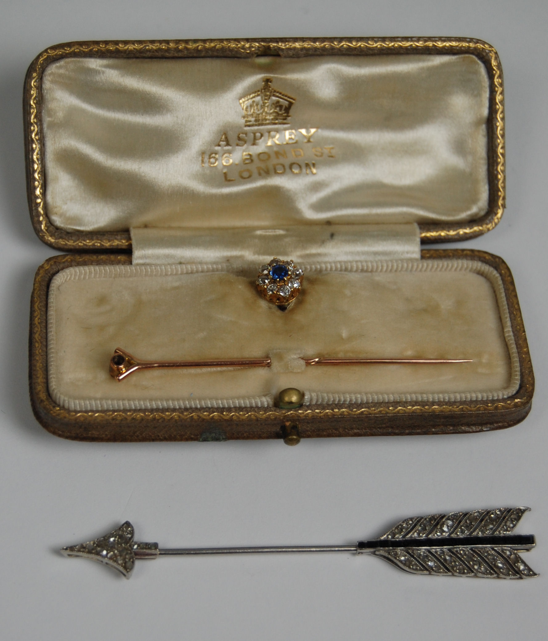 A continental diamond and sapphire set surete pin