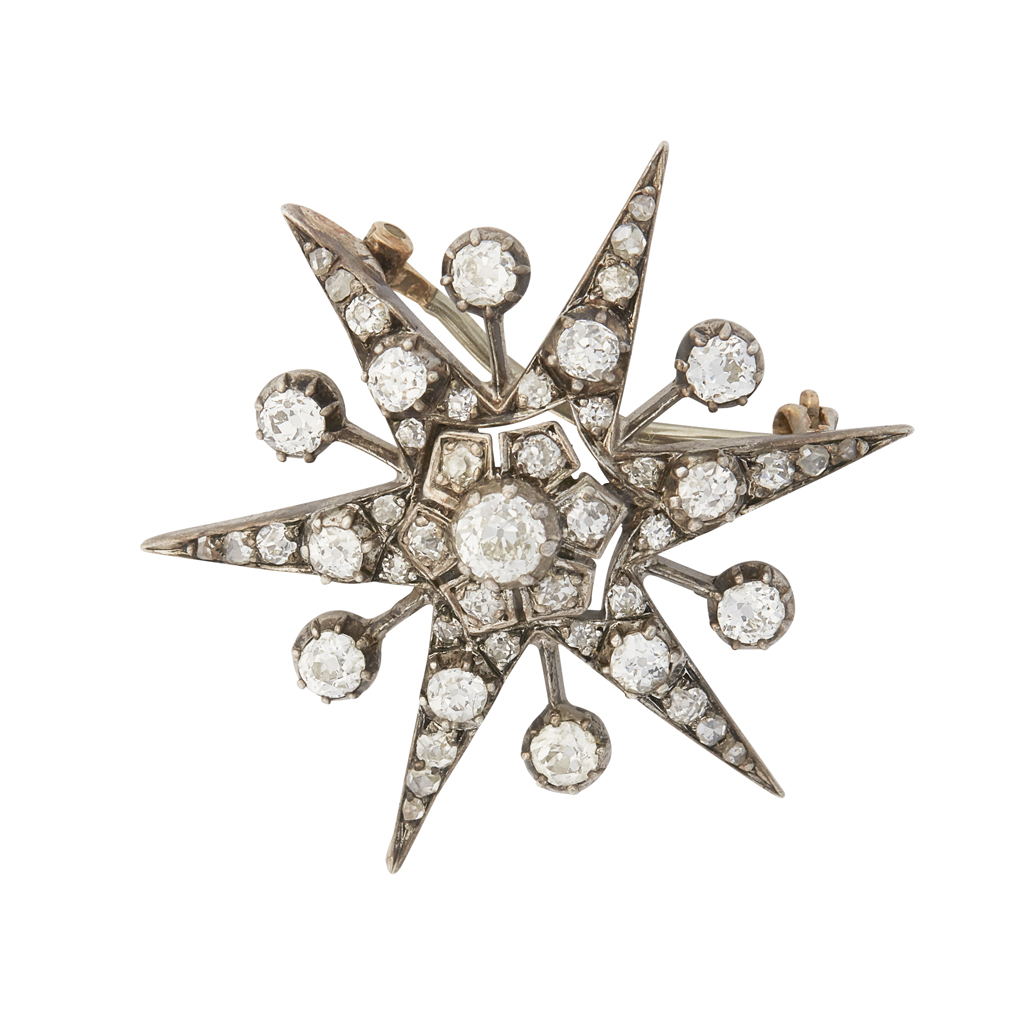 A diamond set star brooch