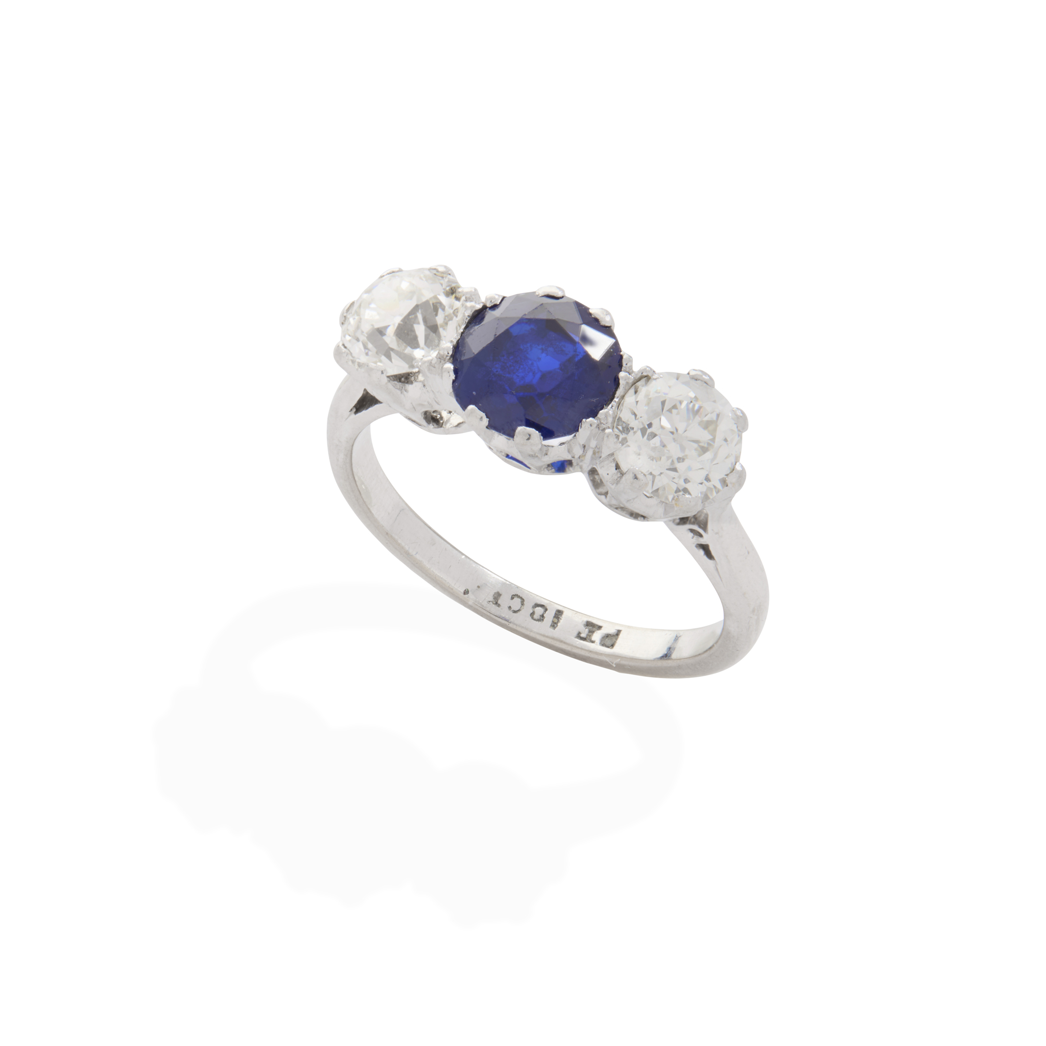 A sapphire and diamond three-stone ring