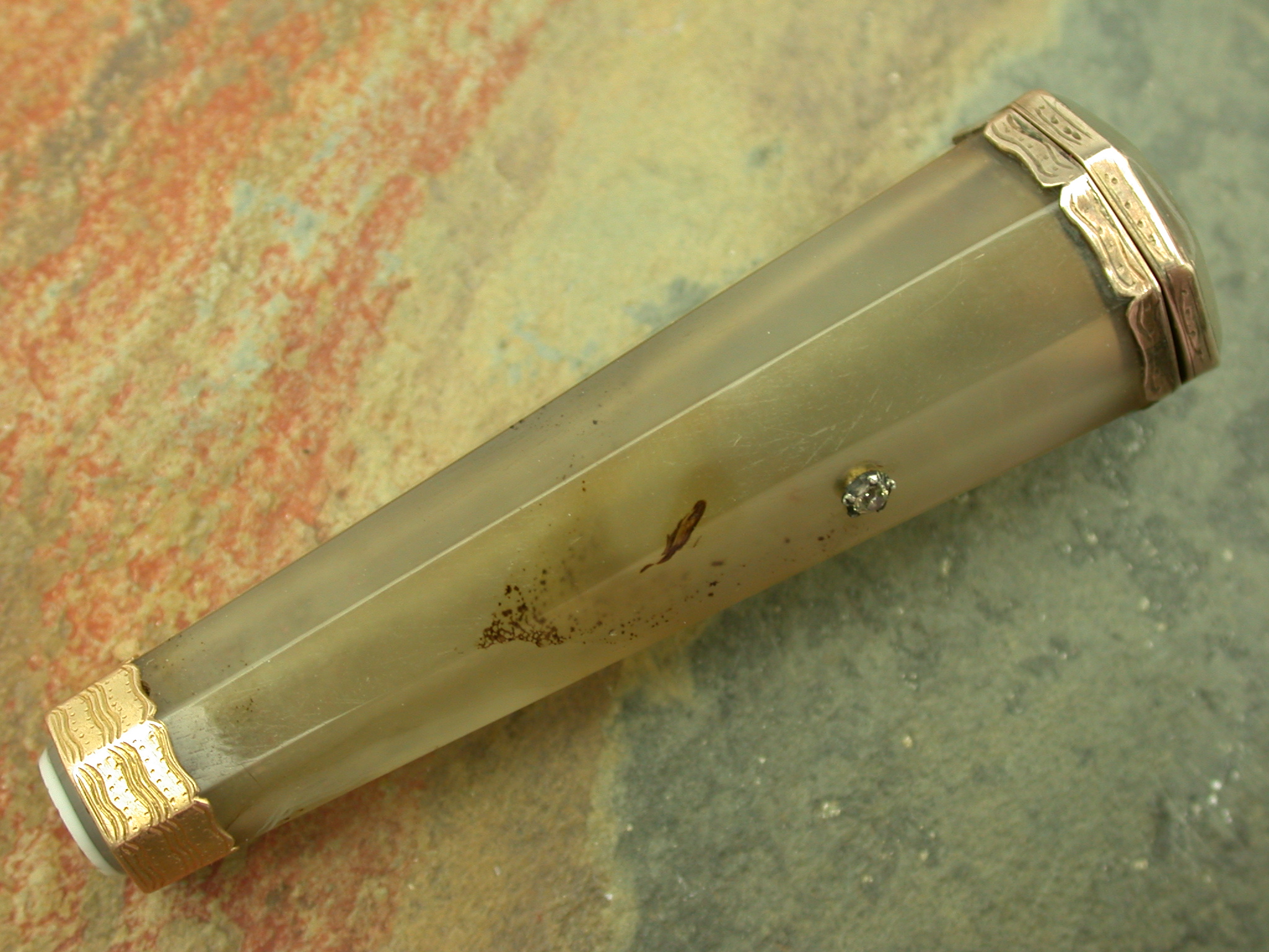 A gold mounted gem set agate box,