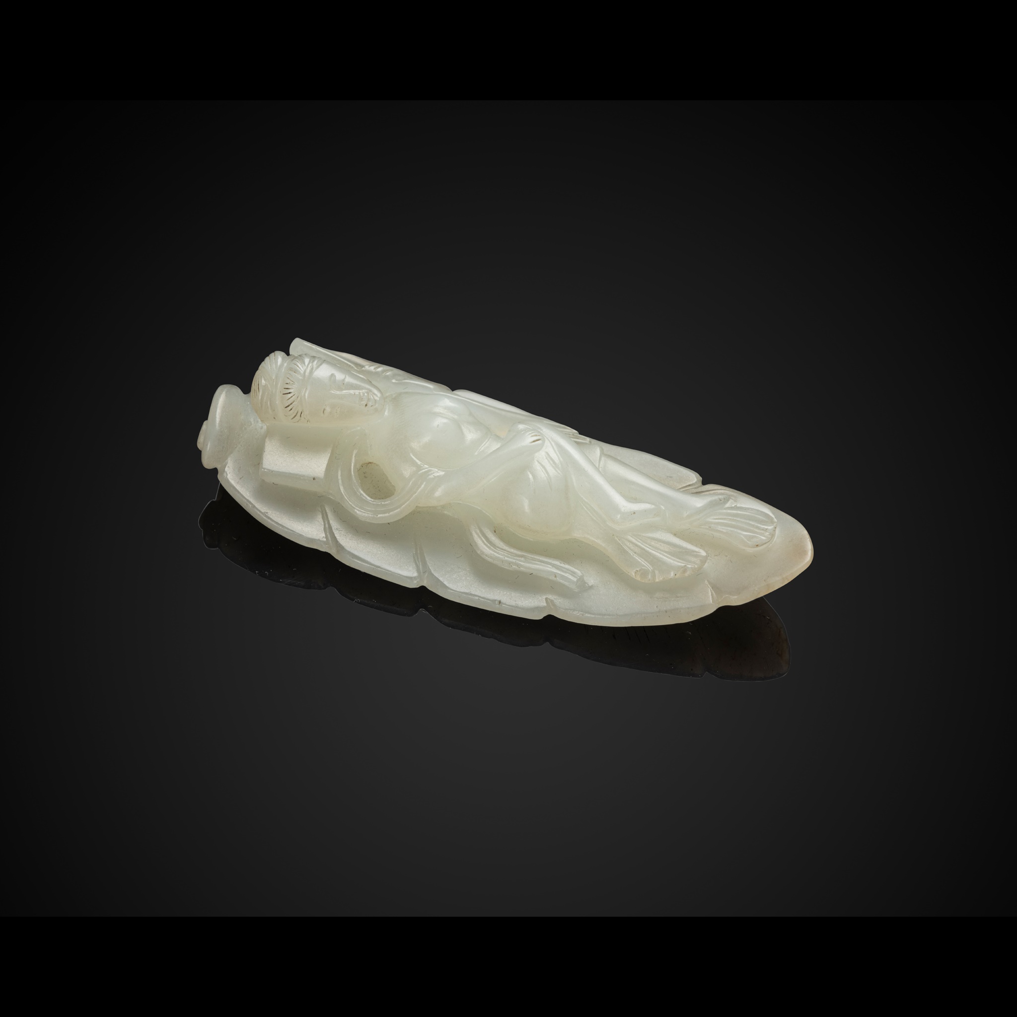 WHITE JADE CARVING OF A RECLINING NUDE