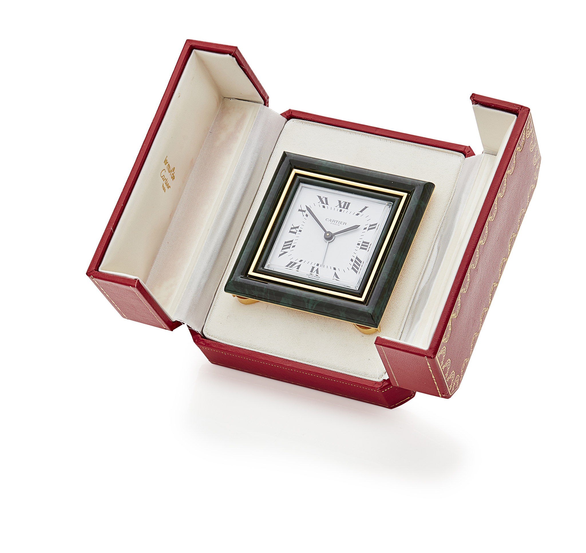 CARTIER - A gilt metal and green clock