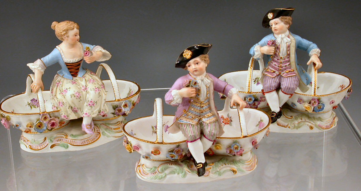 A pair of late 19th century Meissen floral encrusted table ornaments