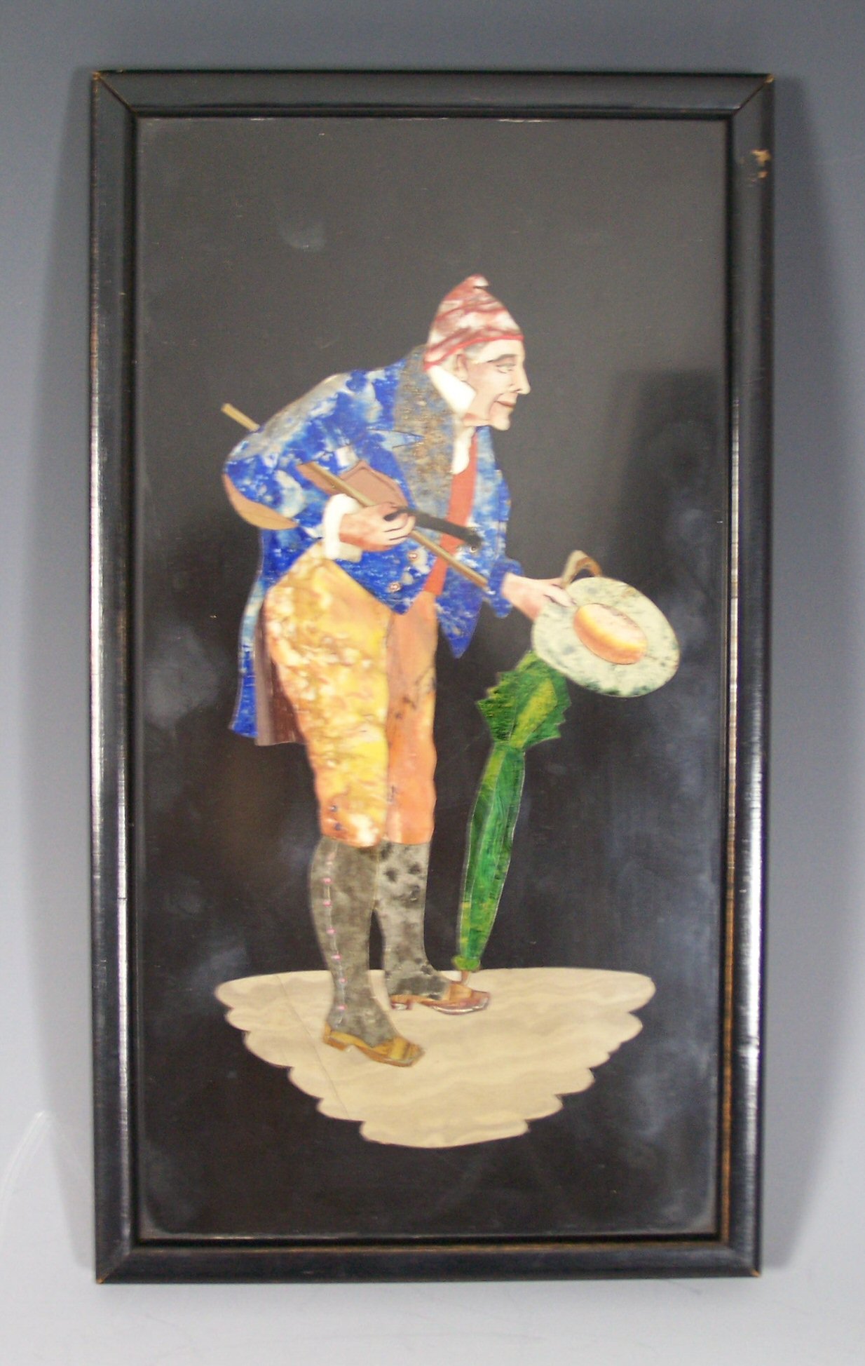 An early 20th century pietra dura panel of an Italian fiddle player