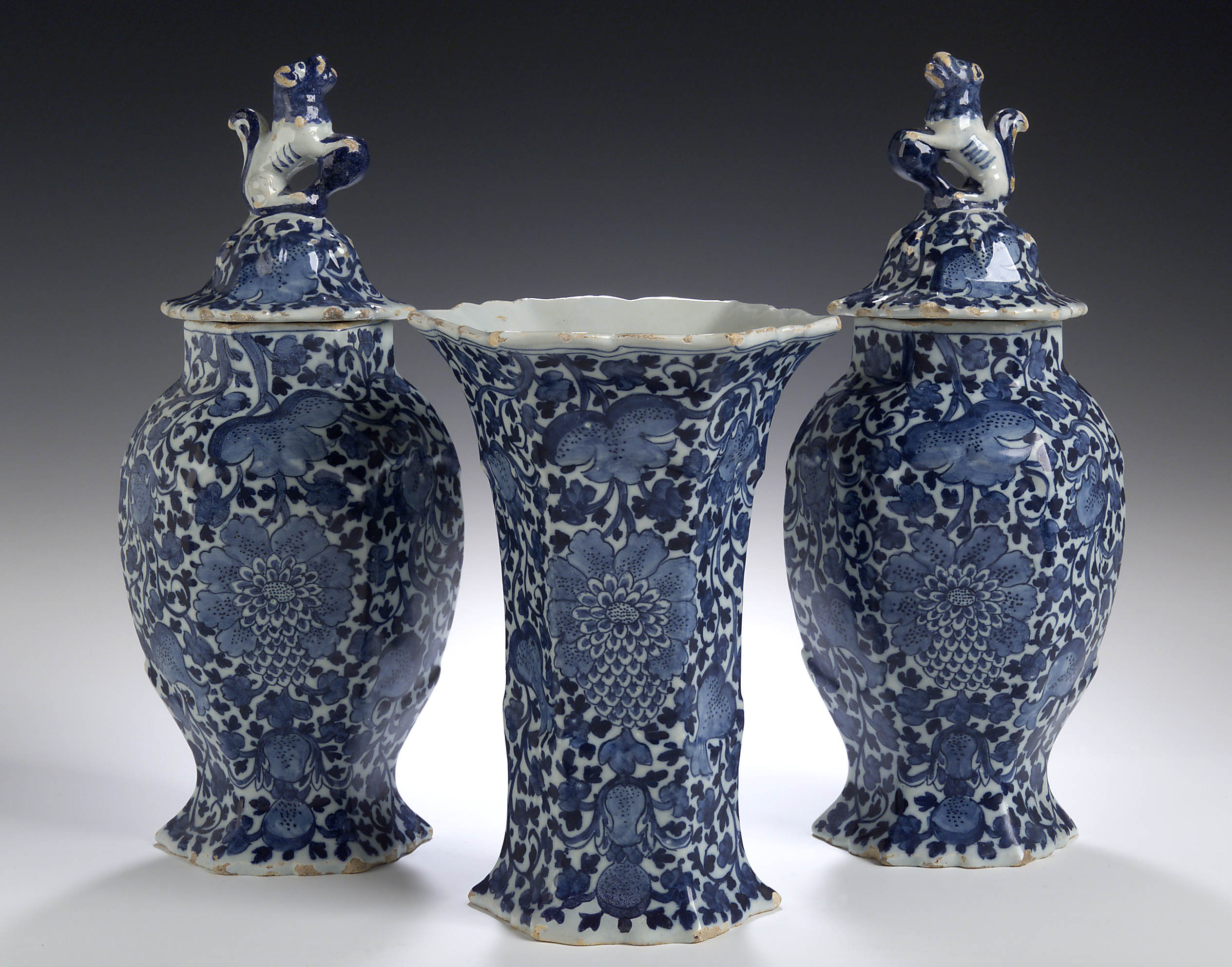 A garniture of three late 18th/early 19th century Dutch Delft vases