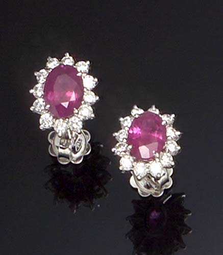 A pair of 18ct white gold mounted ruby and diamond cluster earrings,