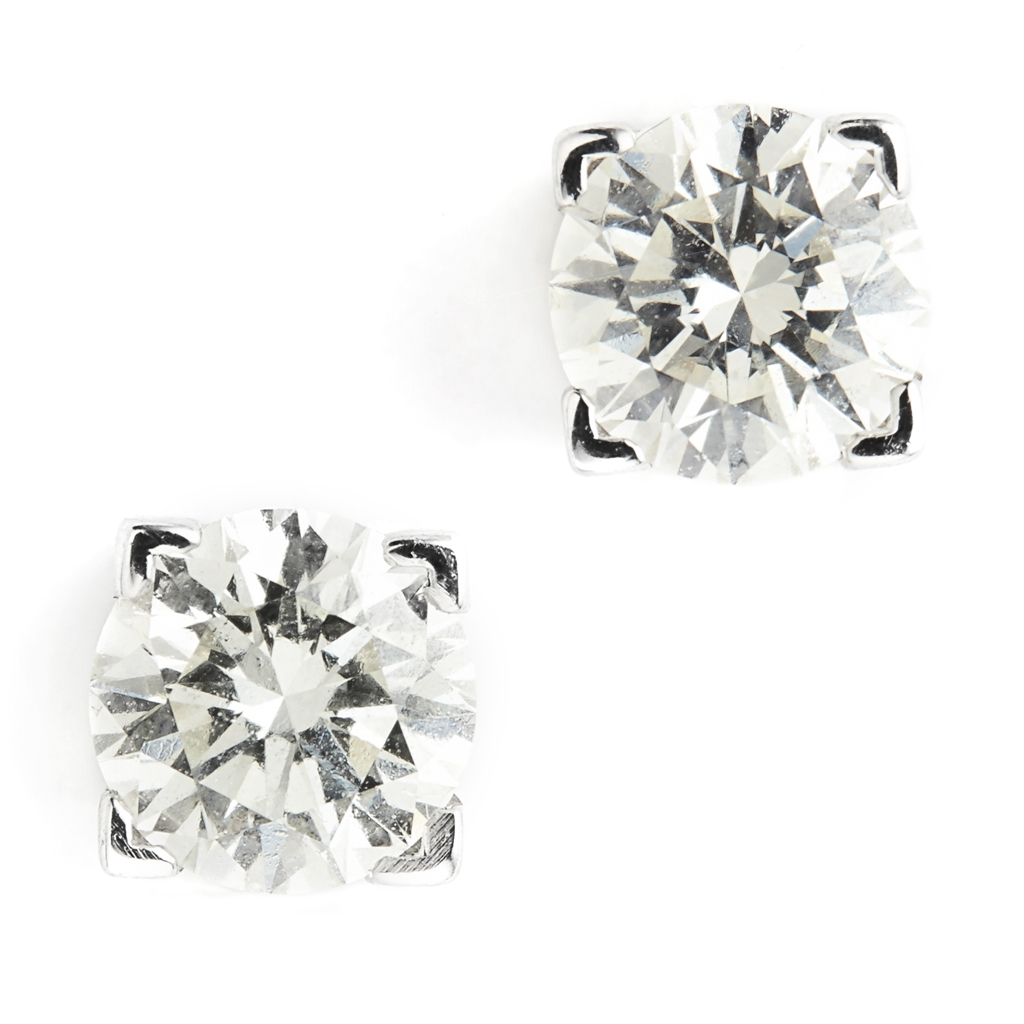 A pair of diamond stud earrings