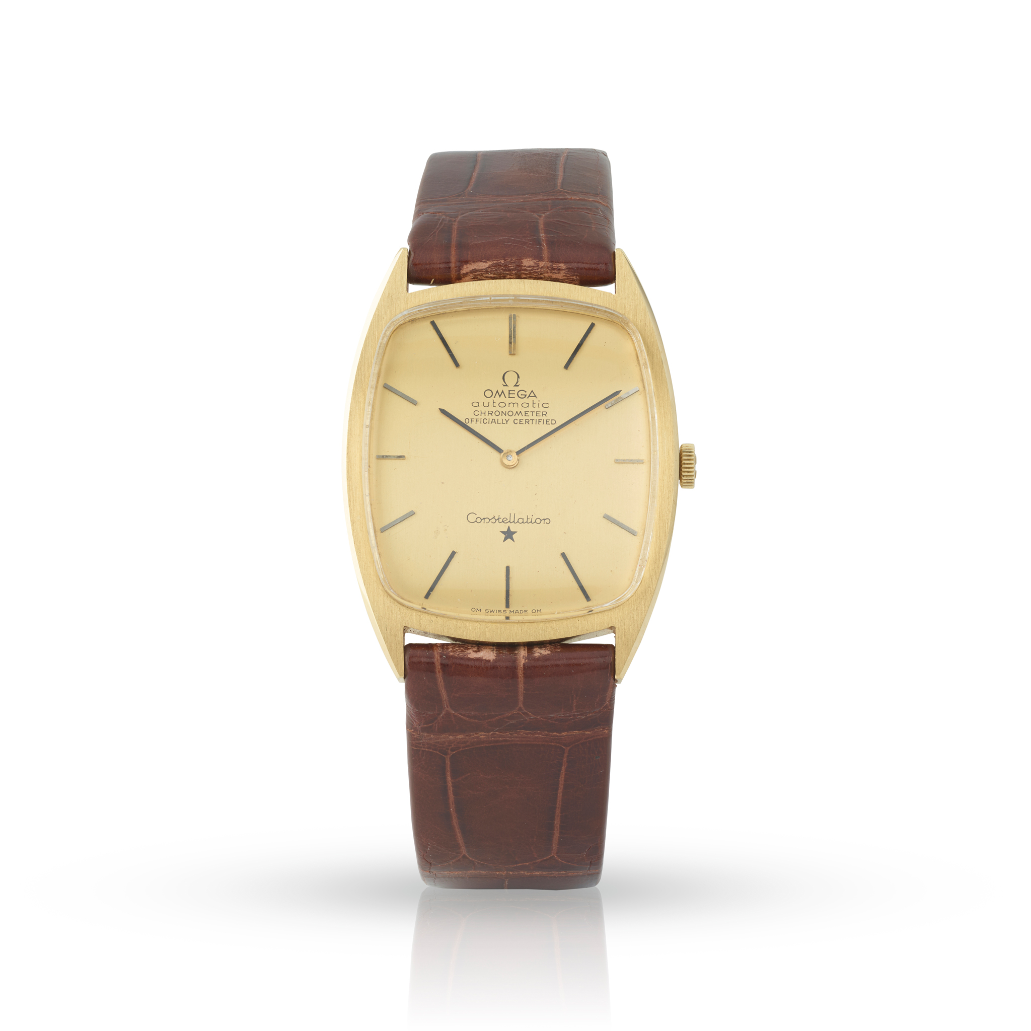 Omega. A very fine and unusual 18k yellow gold tonneau-shape automatic wristwatch