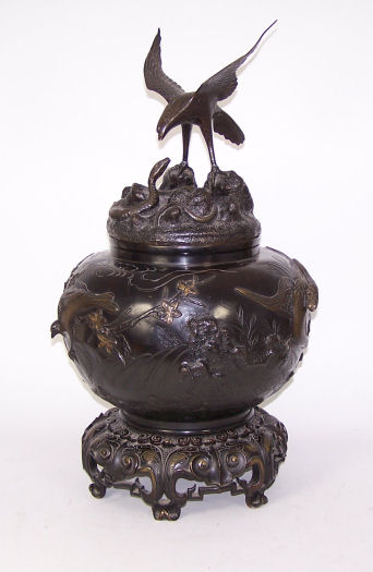 A Japanese bronze vase and cover