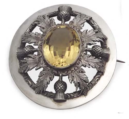 A Victorian silver mounted brooch,
