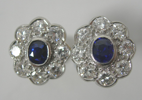 A pair of sapphire and diamond oval cluster earrings,