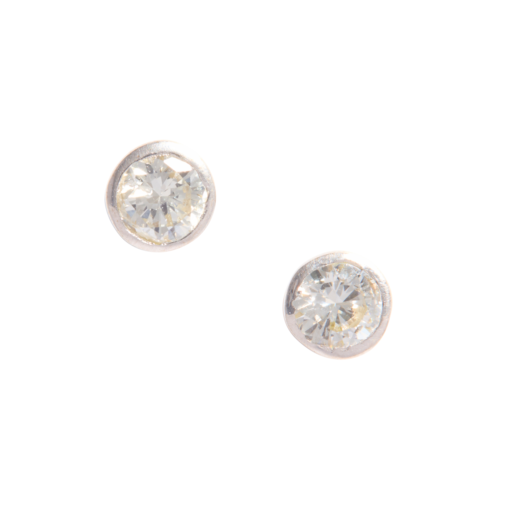 A pair of diamond stud earrings