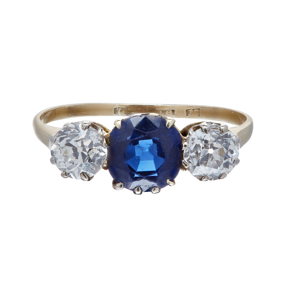 A three stone sapphire and diamond set ring