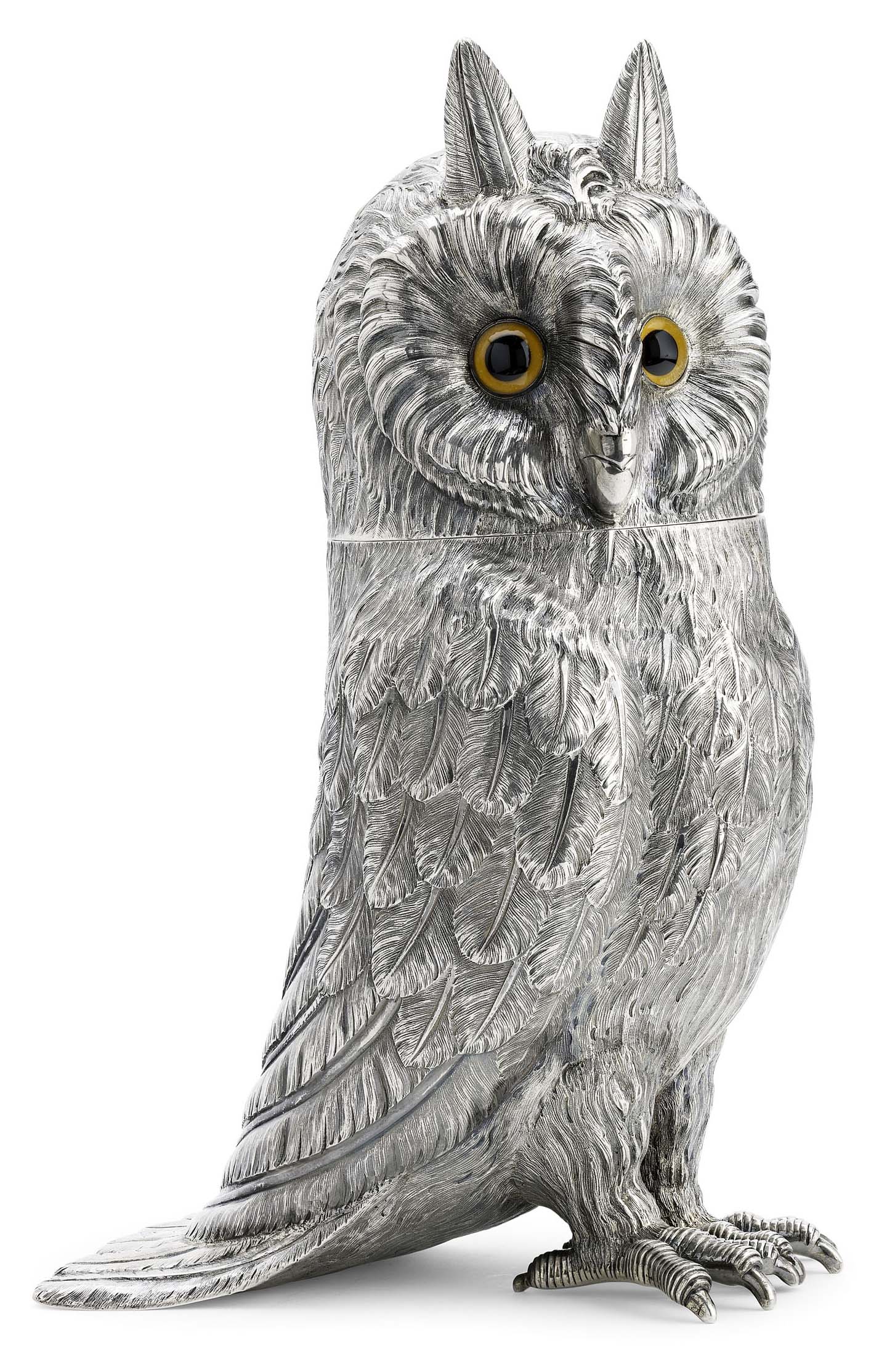 A life-size silver model of a standing owl