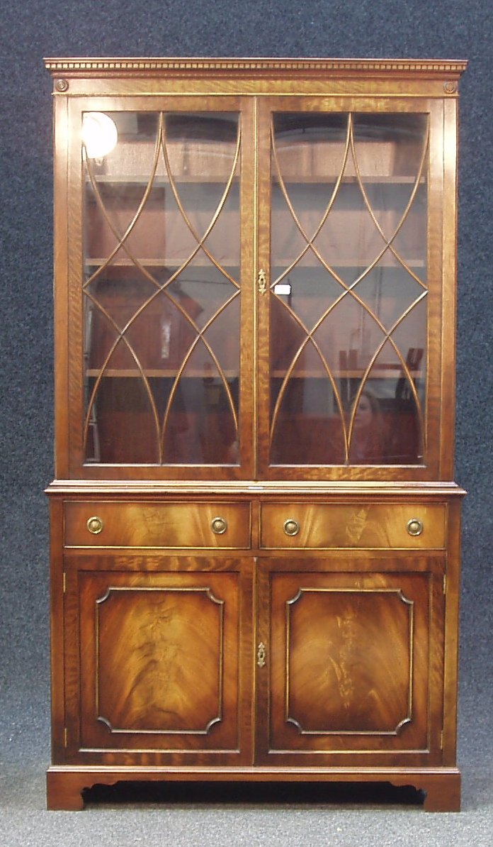 A reproduction George III flame mahogany bookcase,