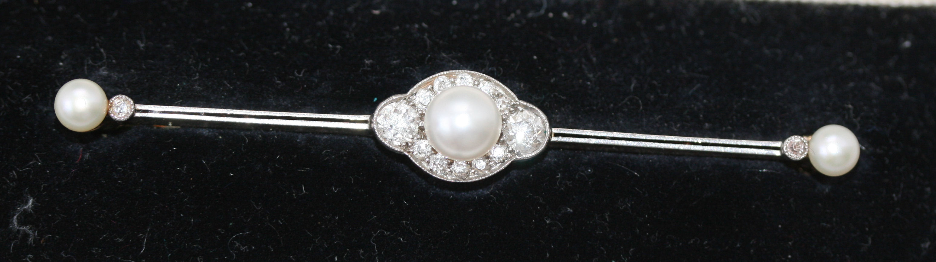An early 20th century bouton pearl and diamond set bar brooch,